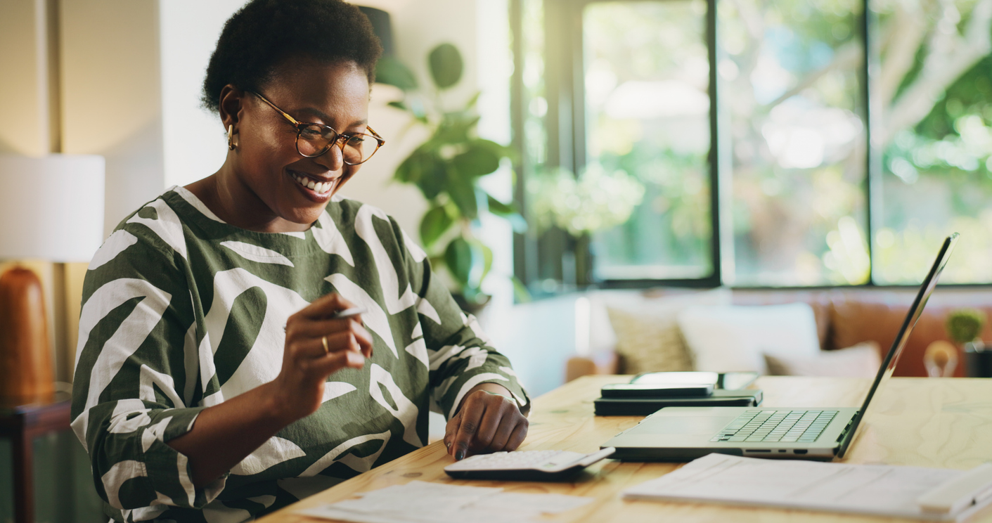 Happy women completing payroll